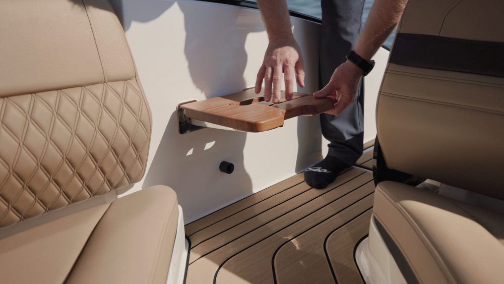 Man folding down the boarding step on an SLX 280